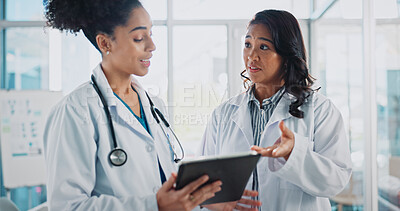 Buy stock photo Women, doctors and talking on tablet in hospital for patient information, appointment and schedule. Database, medical and healthcare practitioner with technology for telehealth, service and medicine