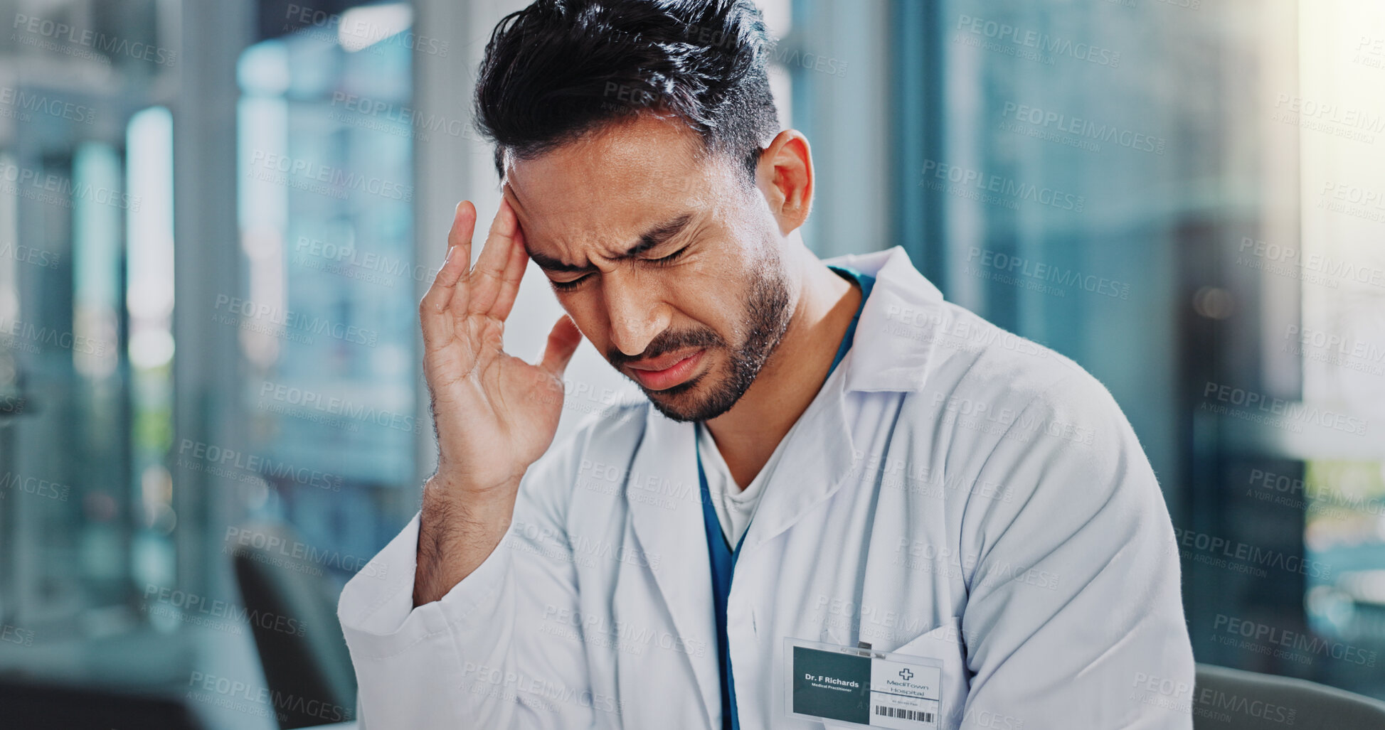 Buy stock photo Doctor, asian man and stress with headache in clinic with anxiety, frustrated and temple massage in office. Person, pain and tired with migraine, fatigue and burnout at hospital in Indonesia