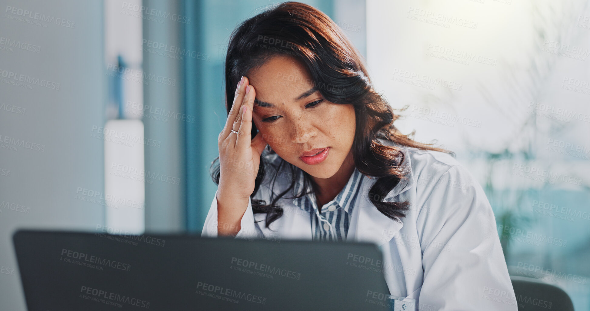 Buy stock photo Headache, doctor or woman on laptop with stress in hospital clinic overwhelmed by emergency. Depression, sick and tired healthcare worker in office frustrated by migraine pain, anxiety or burnout