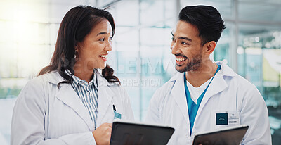 Buy stock photo Doctors, man and woman with tablet, meeting and check results for medical services at hospital. People, teamwork and digital touchscreen in clinical study, review and feedback at clinic in Indonesia