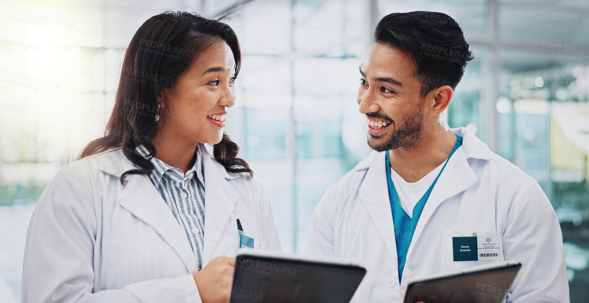 Buy stock photo Doctors, man and woman with tablet, meeting and check results for medical services at hospital. People, teamwork and digital touchscreen in clinical study, review and feedback at clinic in Indonesia