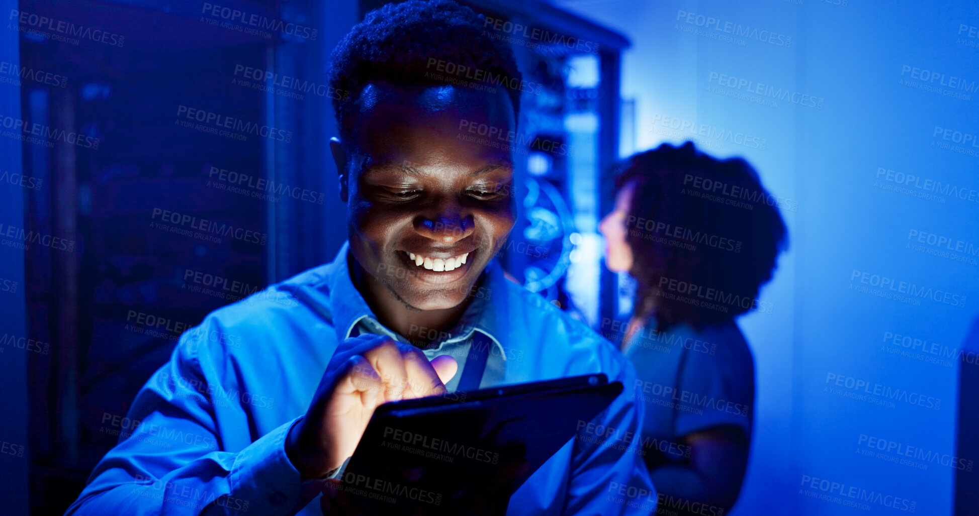 Buy stock photo Man, tablet and server room at night for technology, maintenance in dark data center with neon. Male person, digital information and cloud computing with app, network programming or problem solving