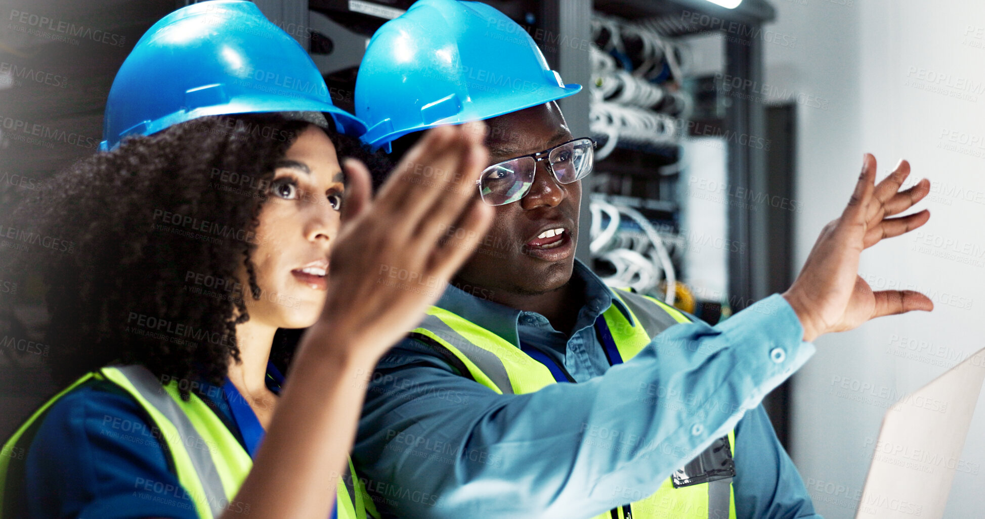 Buy stock photo Team, engineers and communication in server room for support, repairs and equipment by laptop. Man, woman and together with PPE for cybersecurity, collaboration and brainstorming in data center