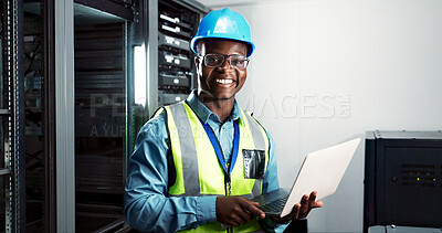 Buy stock photo Technician, laptop and portrait in server room with smile, coding and big data in company. Black man, engineer and happy by mainframe for cybersecurity, networking and maintenance with technology