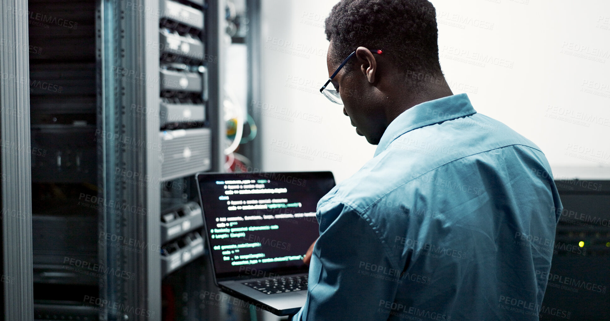 Buy stock photo Server room, black man or coding with laptop for system upgrade, cybersecurity or screen. Software management, data or male programmer with digital for problem solving, analytics or troubleshooting