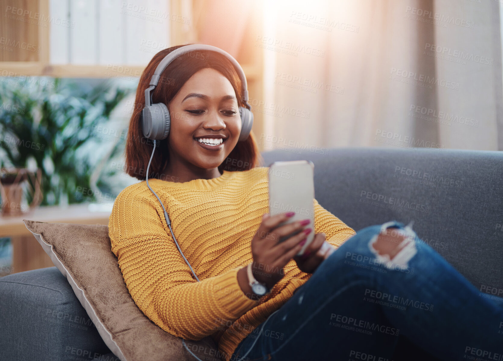 Buy stock photo Happy, headphones or black woman on sofa for selfie, social media or product review at home. Female influencer, music or smile for photography, status update or streaming in living room for followers