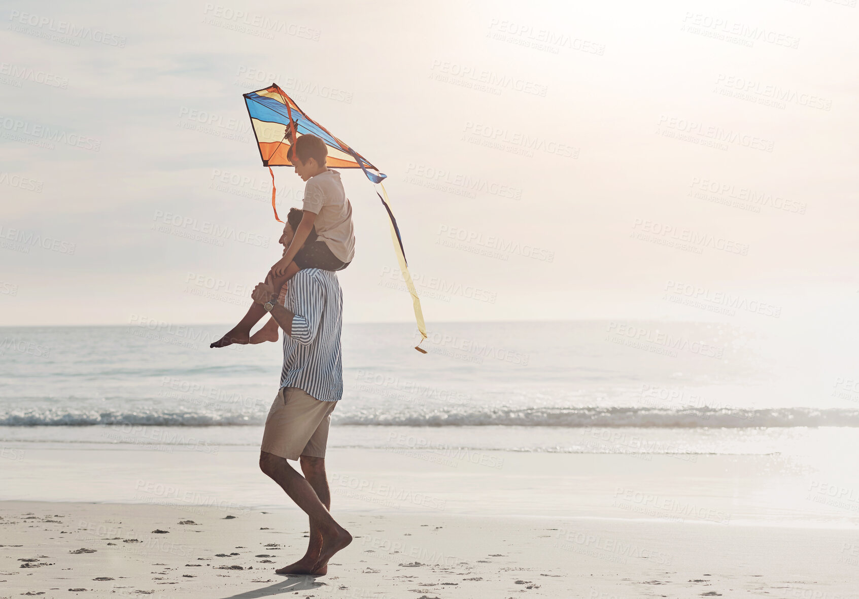 Buy stock photo Beach, kite and child on shoulders of father for adventure, travel or vacation in summer. Walking, toy and boy kid with dad for piggyback, playing or bonding by ocean on tropical holiday in Australia