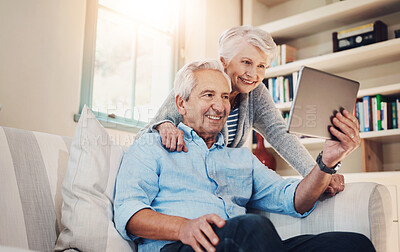 Buy stock photo Senior couple, happy and video call on tablet on sofa in house living room for fun conversation. Smile, elderly man and old woman speaking online for communication, talking and virtual chat together