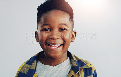 Buy stock photo Portrait, happy and black child in studio for fashion, excited and summer fun. Young kid, smile and face on white background for positive energy, passport or junior school profile update in Nigeria