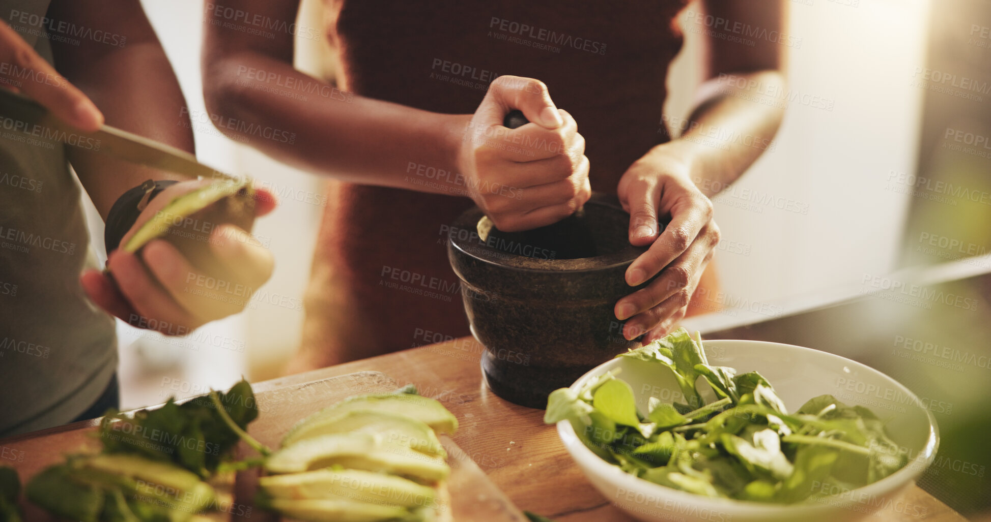 Buy stock photo Hands, couple and healthy food in kitchen with avocado, vegetables and leaves for breakfast or lunch. People with support, helping and cooking together at home for nutrition and care with green meal