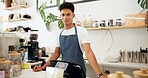 Cafe, portrait of barista and apron with smile for coffee preparation, serving and behind counter to interact with customers. Business owner, employee and service with expresso machine for beverages