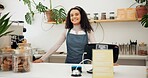 Smile, face and woman barista in coffee shop with positive, good and confident attitude for job. Happy, pride and portrait of young female waitress standing by counter register in cafe or restaurant