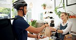 Woman, delivery man and takeaway at restaurant for online order or customer service, breakfast or cafe. Female person, parcel and giving and coffee shop counter of small business, lunch or collection