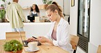 Woman, laptop and typing on smartphone in cafe, remote work and cappuccino in coffee shop for online research. Blog, communication and customer networking on internet, copy writer and relax browsing