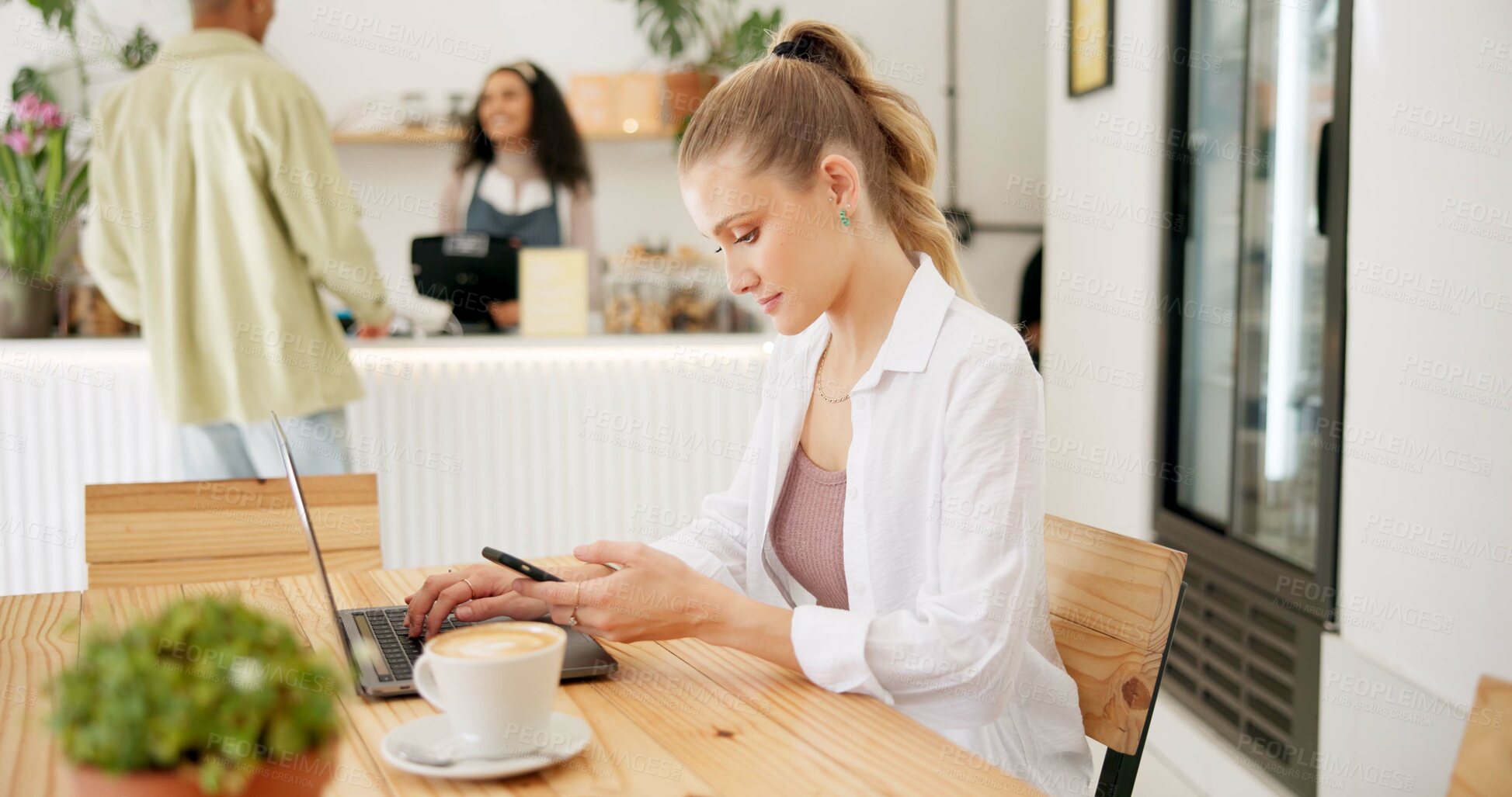 Buy stock photo Woman, laptop and typing on smartphone in cafe, remote work and cappuccino in coffee shop for online research. Blog, communication and customer networking on internet, copy writer and relax browsing