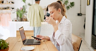 Buy stock photo Woman, laptop and drinking or smartphone in cafe, remote work and cappuccino in coffee shop or online research. Blog, communication and customer networking on internet, copywriter and relax browsing