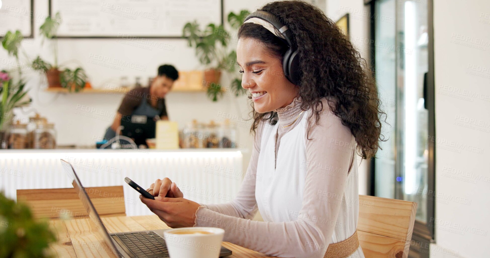 Buy stock photo Laptop, cafe and woman with remote work, phone text and headphones for social media blog post. Typing, music and website update of a web designer working at a restaurant and coffee shop with drink