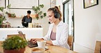 Laptop, cafe and woman with remote work, writing and headphones for social media blog post. Typing, music and website update of a web designer working at a restaurant and coffee shop with drink