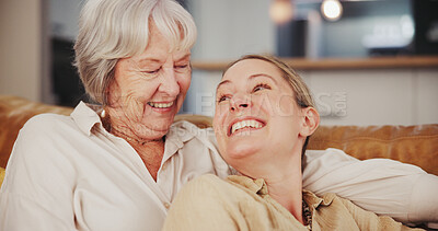 Buy stock photo Happy, sofa and mature mother with daughter laughing together for bonding, relationship and love. Family, home and senior mom with woman in living room for conversation, talking and relax on weekend