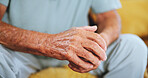 Senior, person and closeup of hands on sofa portrait in home with nostalgia, reflection or thinking in retirement. Elderly patient, wrinkles or mental health with alzheimers in living room of hospice