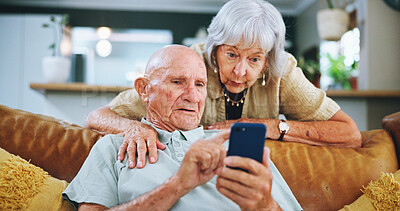 Buy stock photo Senior couple, phone and search on couch for hug, choice and help with video, download and confused in home. Elderly woman, man and smartphone on sofa in lounge with thinking for post on social media