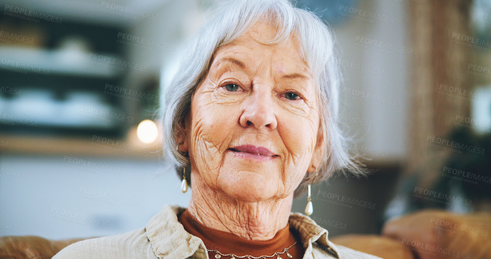 Buy stock photo Senior woman, relax and portrait on sofa in living room on with smile, confidence or pride in retirement. Elderly person, happy and pensioner in lounge on couch for break in apartment at nursing home