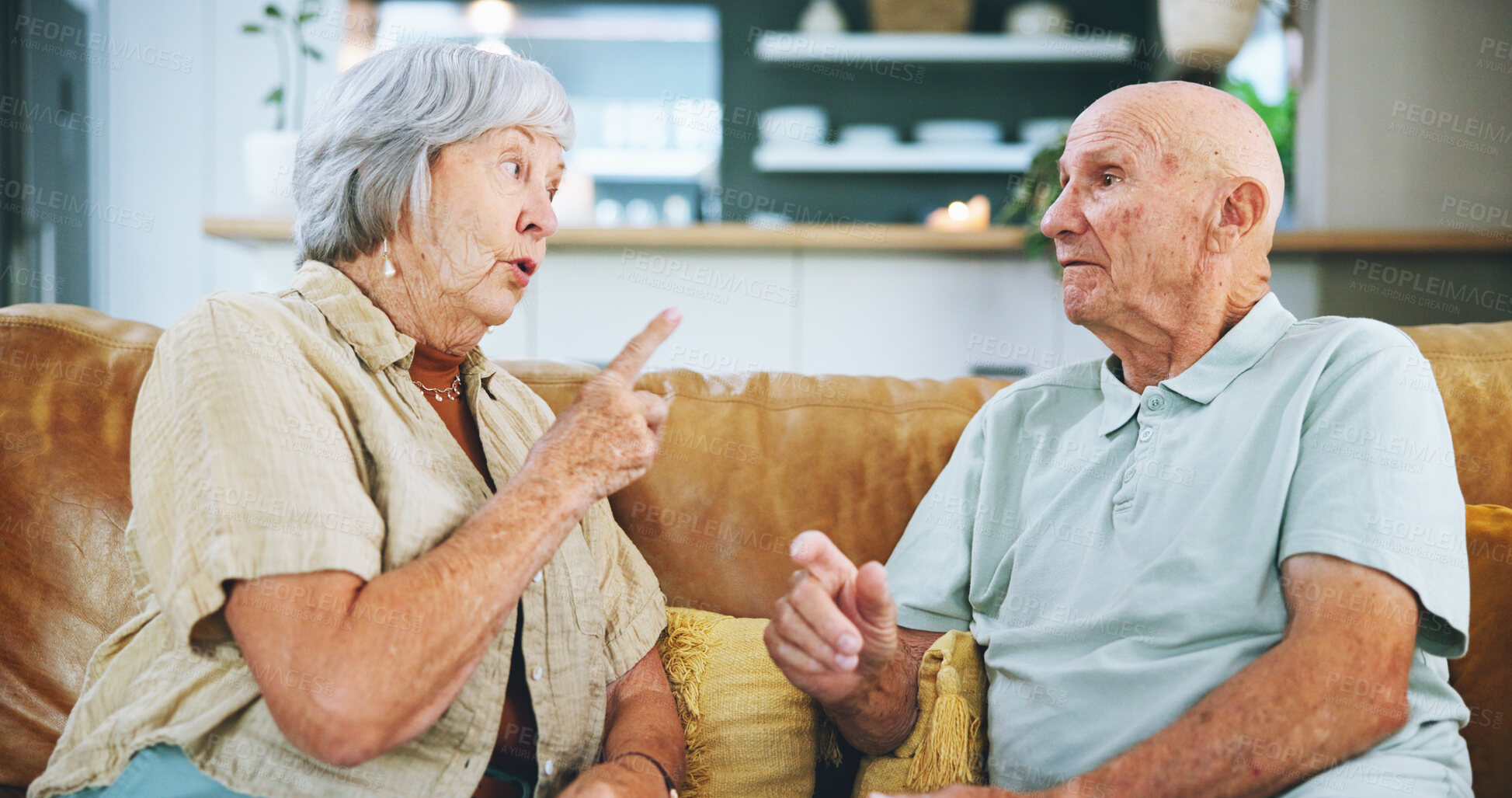 Buy stock photo Senior woman, man and argument on sofa with stress, point and anger with mistake in living room at house. Elderly couple, fight and conflict in discussion, frustrated or relationship on couch in home