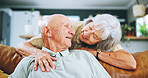 Senior couple, hug and love on sofa with happy marriage, support and conversation of retirement home. Elderly woman talking to man on couch for commitment, health and wellness with trust and security