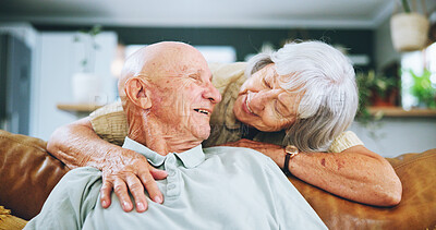 Buy stock photo Senior couple, hug and love on sofa with happy marriage, support and conversation of retirement home. Elderly woman talking to man on couch for commitment, health and wellness with trust and security