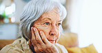 Thinking, home and senior woman on sofa for depression, nostalgia and reflection in living room. Weekend, retirement and closeup of person with thoughtful, memory and wondering expression in house