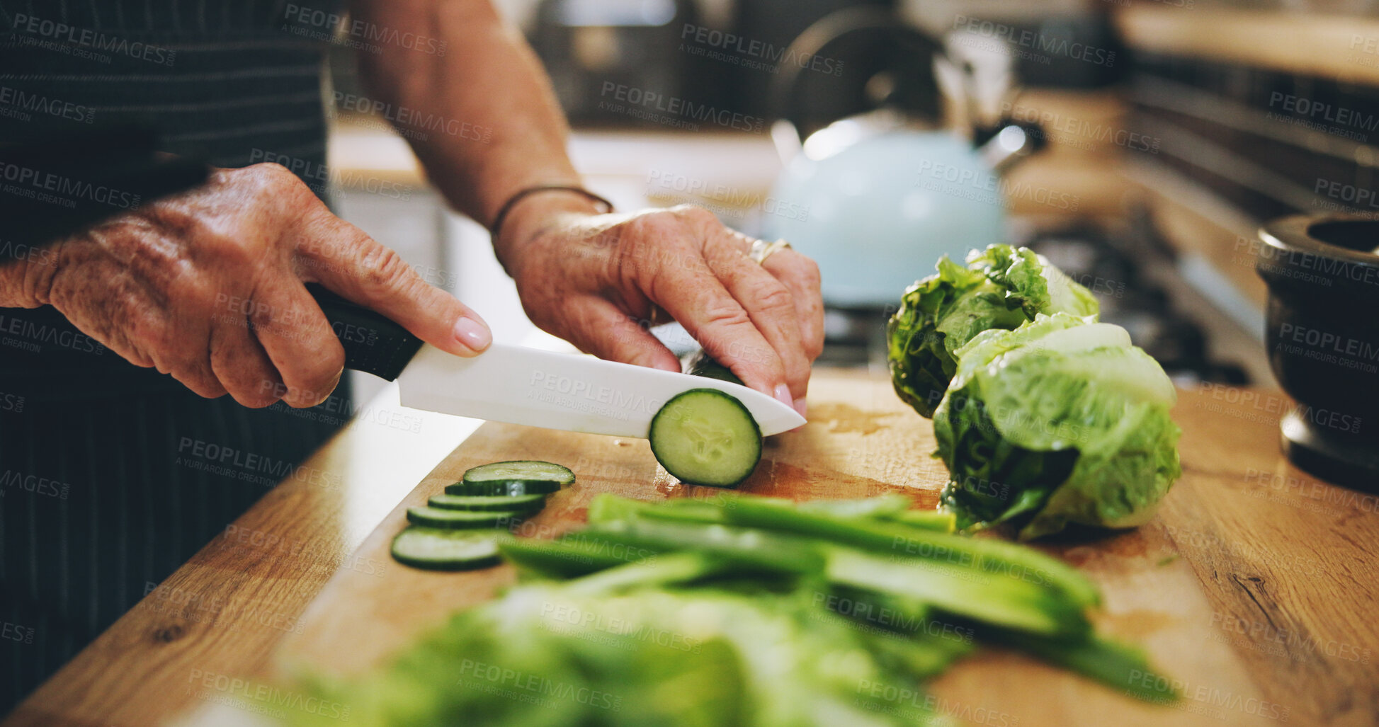 Buy stock photo Hands, cutting board and salad in kitchen with green vegetables for healthy food or nutrition. Person with culinary skills for cooking lunch with lettuce, cucumber and organic ingredients at home