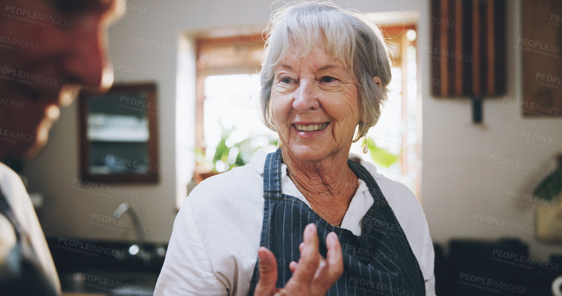 Buy stock photo Senior couple, cooking and happy in kitchen with conversation, help and funny memory in home. Elderly woman, man and talking with meal prep, nutrition and food for wellness in retirement at house