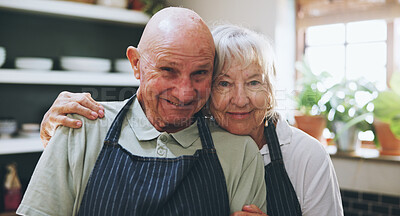 Buy stock photo Senior, couple and portrait with apron in home for bonding, cooking support or fun in retirement. Elderly, people and smile with confidence, wellness or embrace in kitchen for connection or gratitude