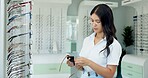 Woman, glasses and cloth at store for optometry, vision and wellness for eyesight, cleaning and choice. Person, worker and fabric for dust with decision for eye care, health and style at retail shop