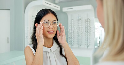 Buy stock photo Woman, optometrist and consultation with glasses in store with choice, help and eye care for vision. People, optician and customer with smile for health, wellness or decision for trendy style in shop