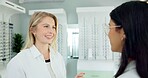 Consulting, optometrist and help customer with glasses for eye health, wellness or care. Ophthalmology, lens frame and happy woman with client for vision, spectacles or eyesight correction at store