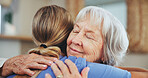 Senior woman, nurse and hug with support for love, elderly care or assistance at nursing home. Female person or caregiver with mature patient for embrace, healthcare or bonding at old age house