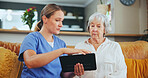 Senior woman, nurse and consulting with tablet for healthcare, medicare or results at nursing home. Female person or caregiver talking to mature patient with technology on living room sofa at house