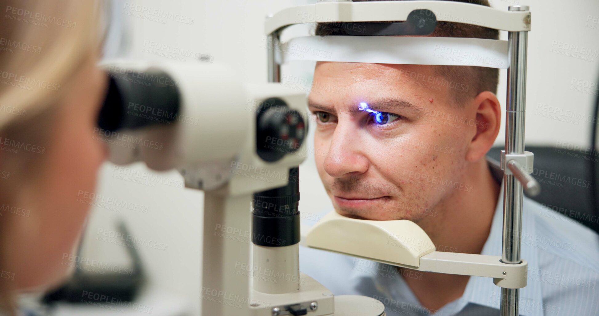 Buy stock photo Optometrist, patient and assessment in clinic for eye exam, vision and optometry with ophthalmoscope. Specialist, man and machine in hospital for wellness, healthcare or ophthalmology for glaucoma