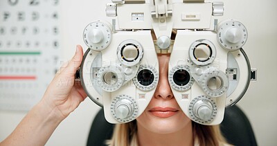 Buy stock photo Optometrist, woman and phoropter for eye exam, hands and wellness in consultation room at hospital. People, doctor and patient with machine, lens and vision assessment for healthy eyesight in clinic