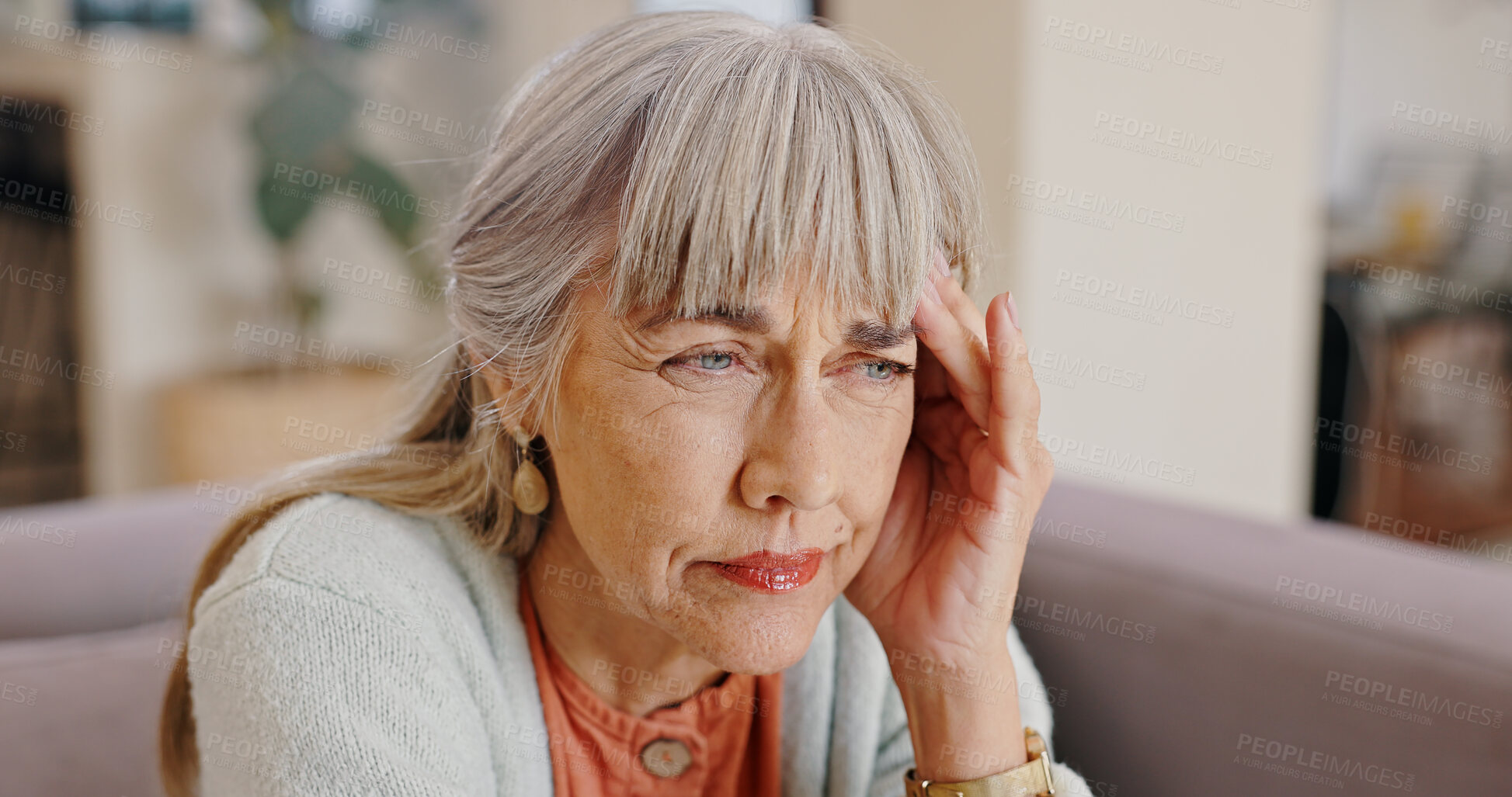 Buy stock photo Senior woman, thinking and mental health in nursing home, hand and memory of past, retirement and depression in lounge. Grandma, lonely and couch of house, widow and elderly person with grief and sad