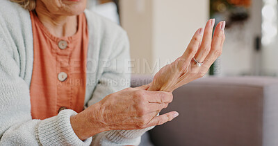 Buy stock photo Medical, wrist pain and senior person with arthritis, osteoporosis and fibromyalgia on sofa. Home, lounge and woman with hands massage for discomfort, bruise muscle and carpal tunnel in retirement