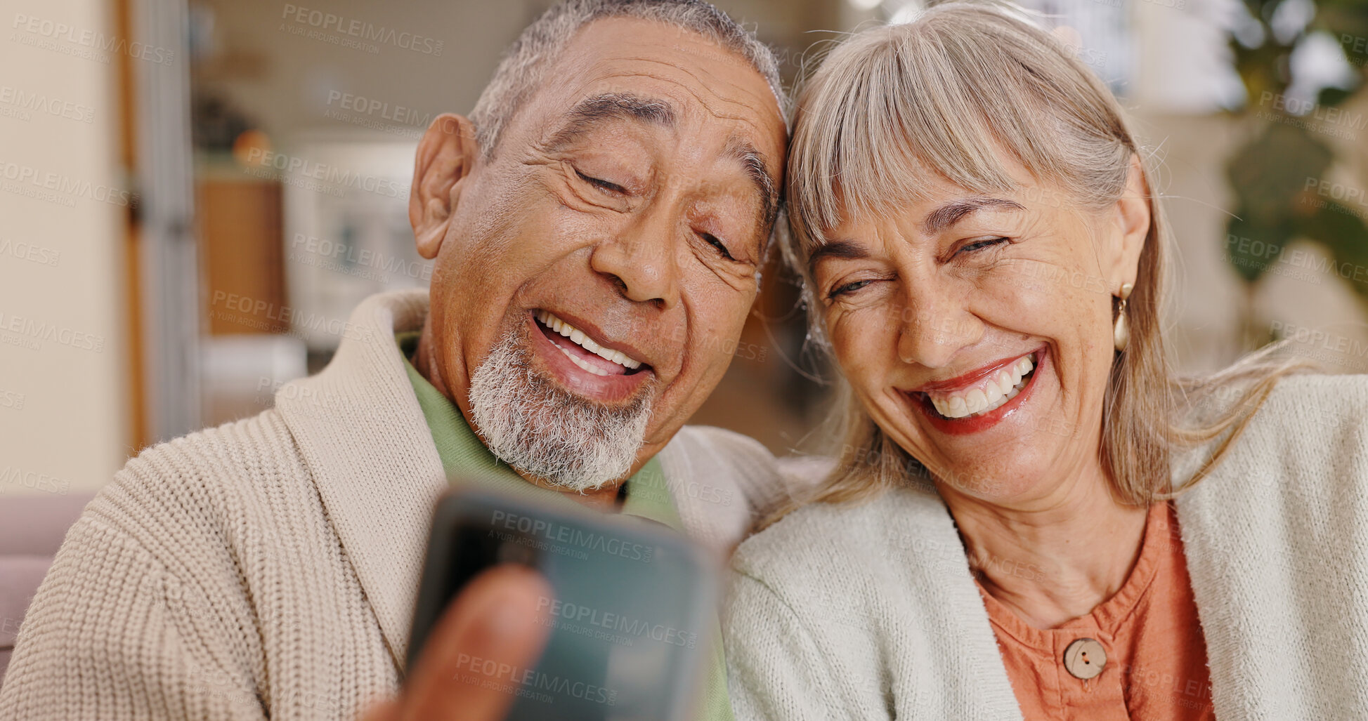 Buy stock photo Elderly couple, selfie and smile in lounge, love and together in house, online and photography for memory. Home, profile picture and old man with woman, happiness and app in mobile and post in web