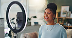 Woman, light and mobile for vlogging in home, smile for announcement with audience. Internet, female influencer or website in house with smartphone, creative review for audience with media technology
