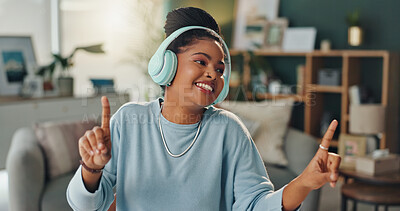 Buy stock photo Dancing, music and black woman with headphones in home with streaming hip hop playlist and online radio for sound. African person, gen z girl and happy singing with listening to rap song for fun