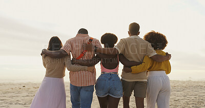 Buy stock photo Travel, hug and back of friends on beach for tropical, summer or island vacation together. Bonding, seaside and group of people embracing with care by ocean for holiday, adventure or weekend trip.