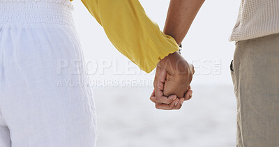 Buy stock photo Couple, people and outside or holding hands on beach, relationship and commitment on weekend break together. Trust, support and love for bonding with partners, romance and nature with empathy