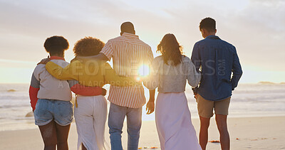 Buy stock photo Ocean, back and friends hug at sunset on vacation, holiday and travel on tropical island. Embrace, men and group of women at sea outdoor for journey, relax or bonding at beach on summer trip together