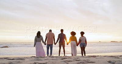 Buy stock photo People, friends and holding hands by ocean for freedom, outdoor adventure and happiness on summer vacation. Beach, back and youth together with seaside fun, united and group on holiday for weekend.