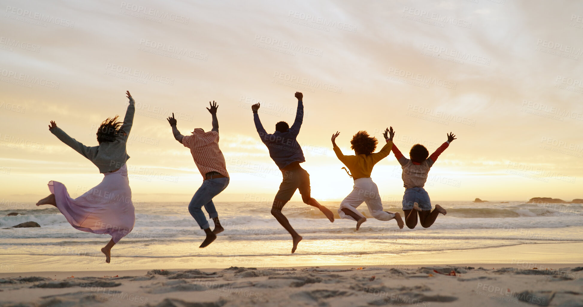 Buy stock photo People, friends and jump on beach for freedom, outdoor adventure and group happiness on summer vacation. Carefree, back and youth energy with seaside fun, excited and sunset on holiday for weekend. 